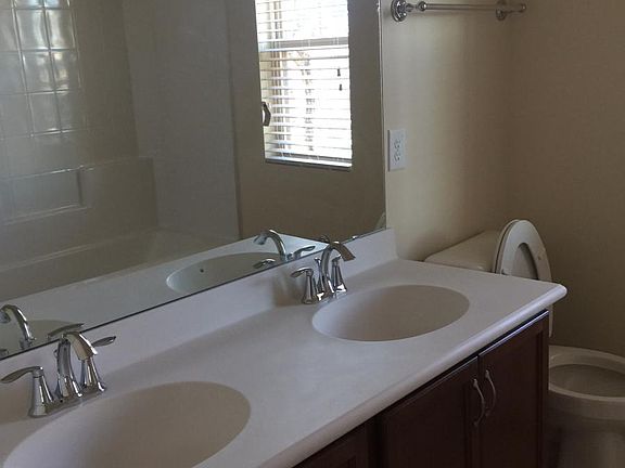 hall bathroom upstairs w/ dual sinks