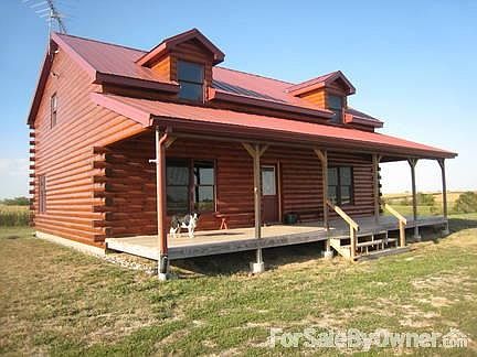 Front of the Cabin facing South
						:
						The County Road is about 700' behind the cabin. No road dust, a lot of privacy.