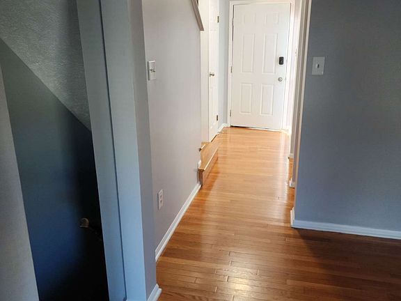 First Floor hallway to dining/living room and basement stairs