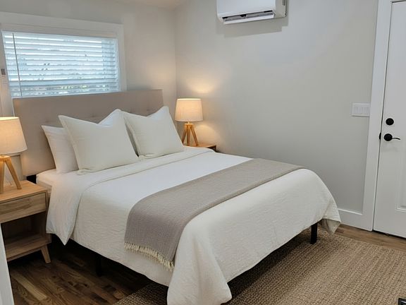 Bedroom #1- solid wood floors, walk in closet area with w/d.