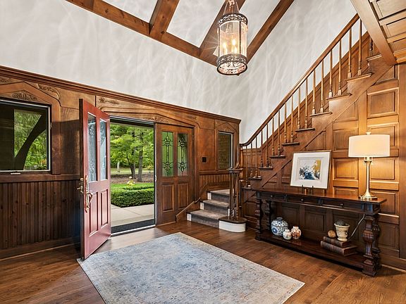 Stunning entry with unheard amount of wainscoting,