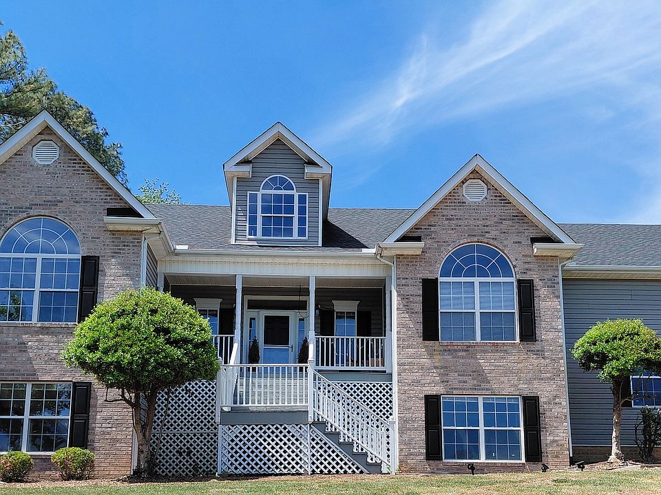 Main home exterior private lower-level apartment with separate entrance and deck access