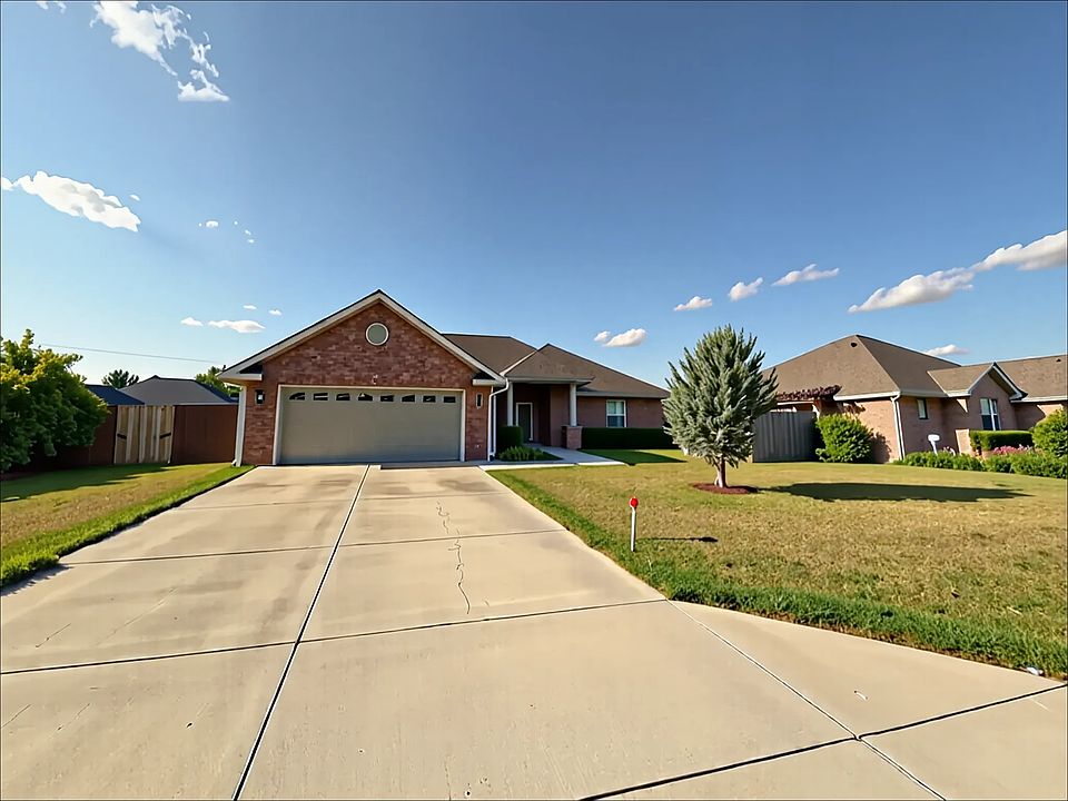 Welcoming curb appeal with a spacious 2-car garage and a quiet front yard_ideal for kids, pets, enjoying the neighborhood breeze or welcoming the hundreds of trick or treaters!