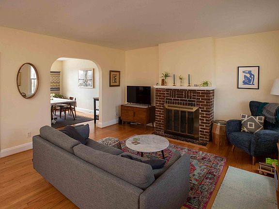 Large living room with beautiful hardwood floors.