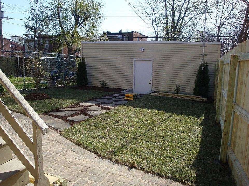 Backyard renovation showing new 2 car garage 2009