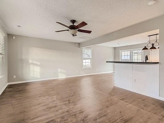 Family room open to Kitchen and Dining area.