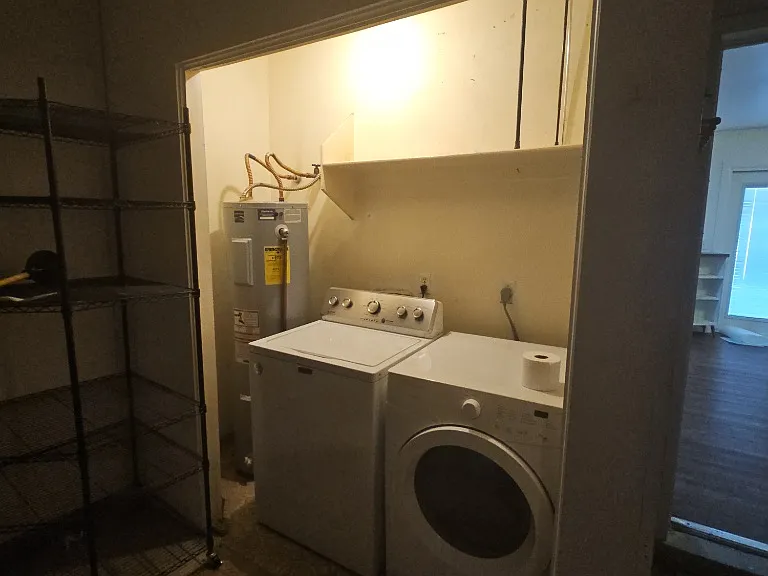 Laundry room located in the garage.