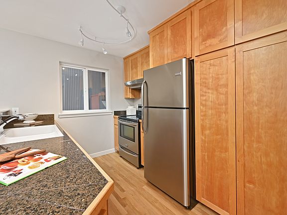 First floor kitchen port renovation. large electric convection range, refrigerator, dishwasher. plenty of storage and pantry space.