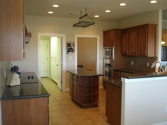 Well laid out kitchen with upgraded stainless appliances and granite counters.