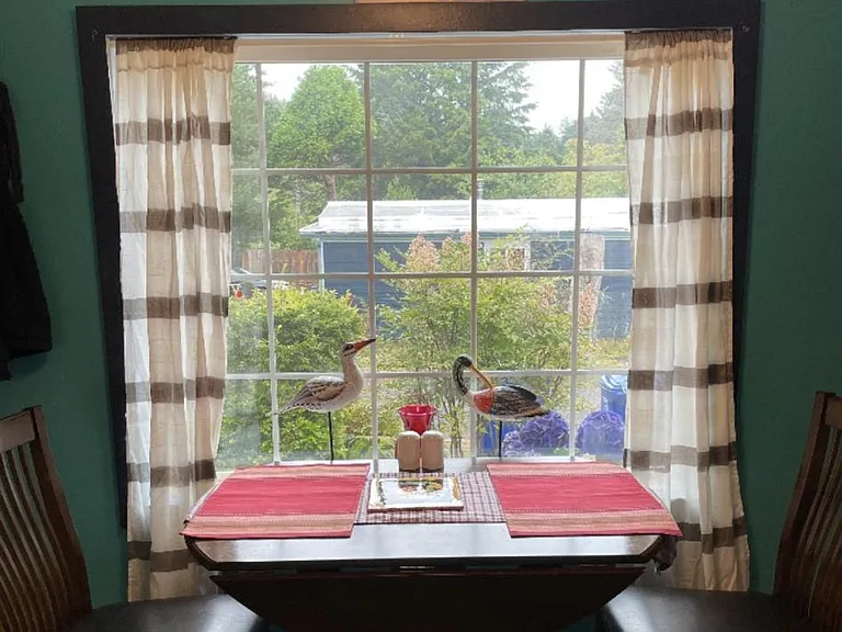 Large Kitchen with a Table and 2 chairs