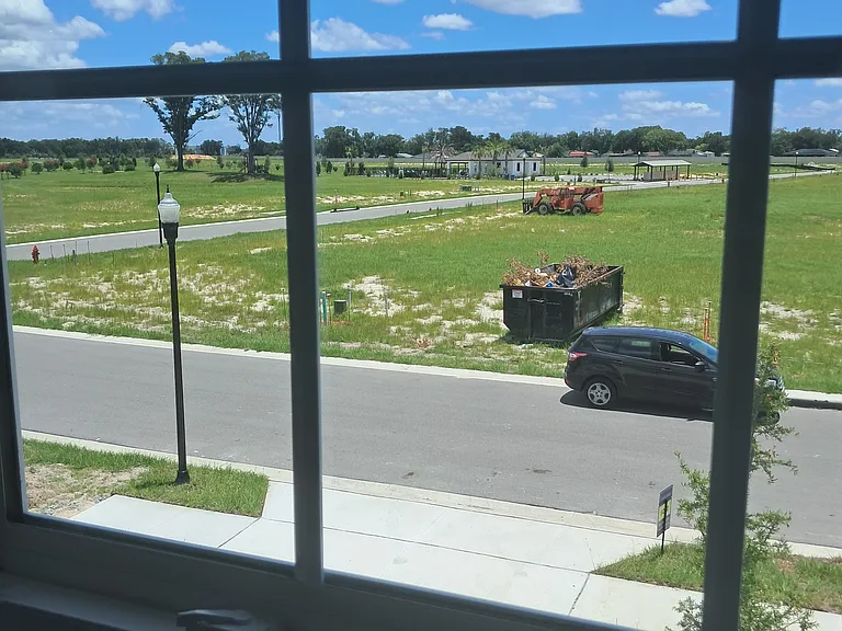 Bedroom View with the Clubhouse/Pool/playground in the background