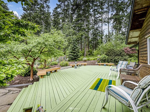 The home is buffered by mature trees.  The deck is on the west side of the home.  