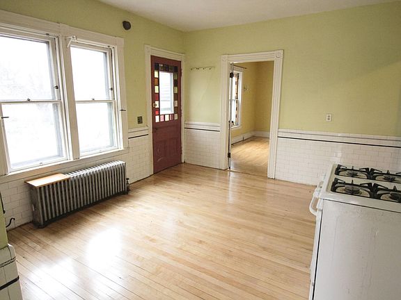 Kitchen features sunny garden views and stained glass door