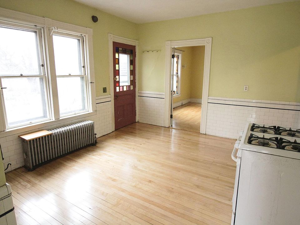 Kitchen features sunny garden views and stained glass door