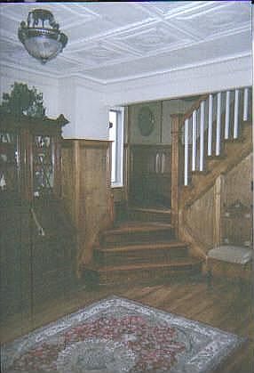 Custom woodwork, stairs, wood floors, tin ceiling
