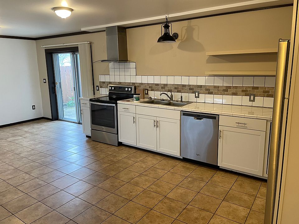Hallway view: kitchen, backyard patio.