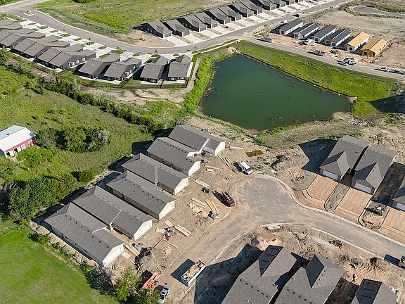 under construction photo, property is lower right of the pond.