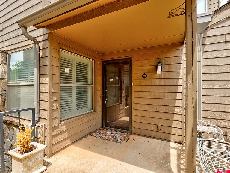 Small front porch with security glass door.