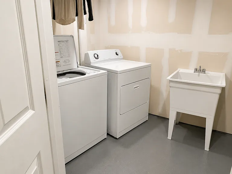 Laundry & Mechanical room (entrance off downstairs master bedroom).