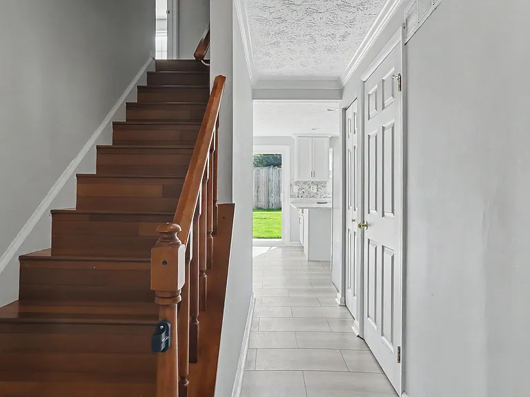Entry Hallway, Half Bath on Right