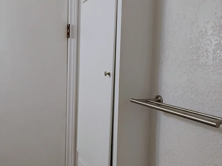 Storage inside the bathroom. Bottom bin is for dirty laundry