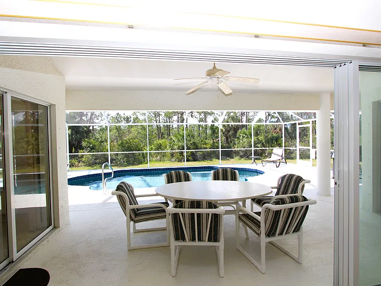 Lanai seating overlooking the pool_11182023
