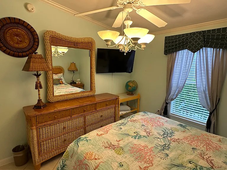Second bedroom - view #2 (Note: all bedrooms have ceiling fans and wall mounted TVs)