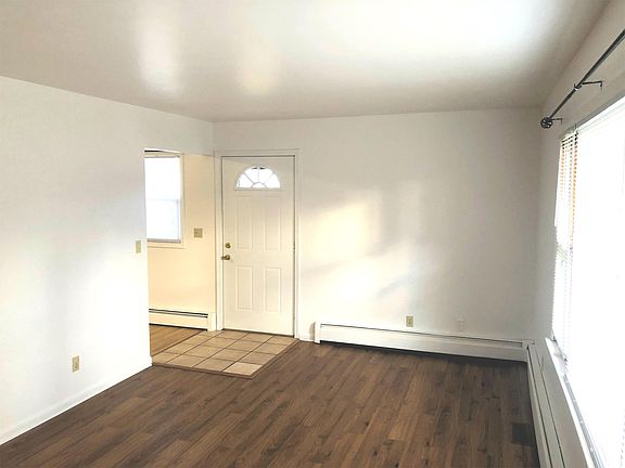 Beautiful brand new hardwood flooring with giant sun loving family room windows.