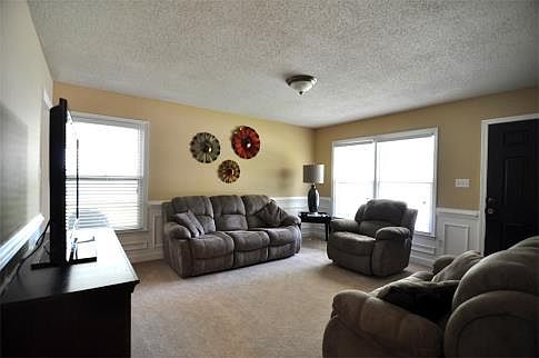 Welcoming Entry Into a Living Area With Wainscoting is a Pleasant First Impression