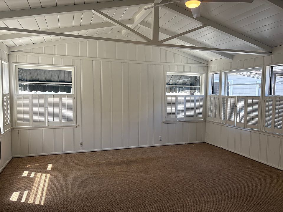 Great Room with open beams, windows on 3 sides