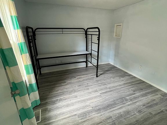 Bedroom 4. This is the one that is off the kitchen/dining area *curtain and bed frame will be removed prior to renting