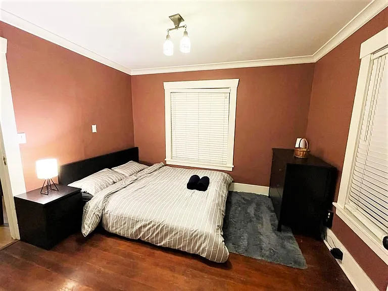 Spacious bedroom #1 with queen size bed and closet. 2 big windows so getting good sunlight during the day (picture taken at night).