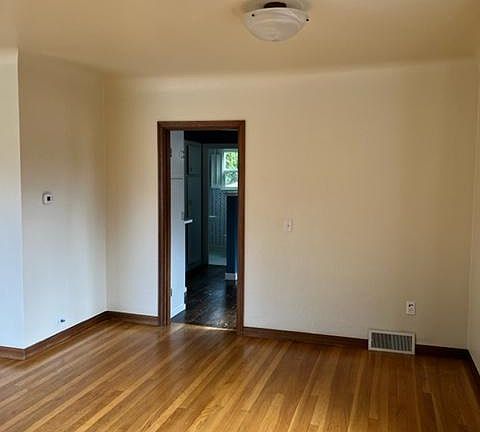 Dining room with original hardwood floors.