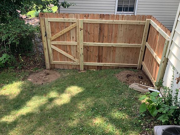 New fenced-in yard with dual gates added 2022