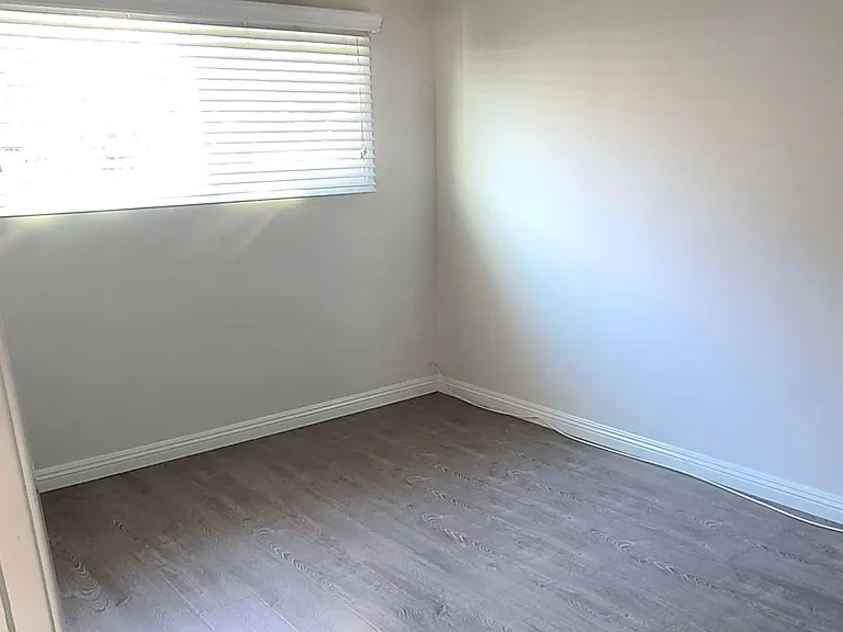 Bedroom 1. Window A/C is available and included with the rent.