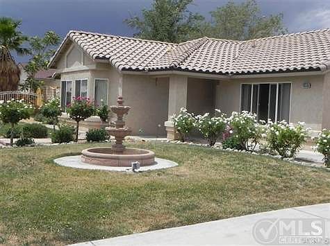 Front rose garden view with beautiful fountain.