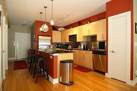 Kitchen w/Stainless Steel Appliances and Backsplash