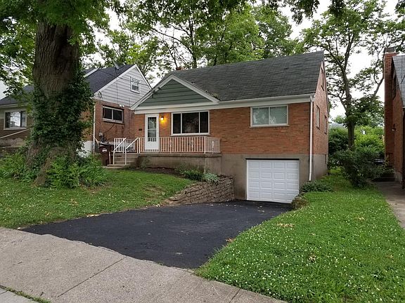 One-car garage. Tree lined street with sidewalks