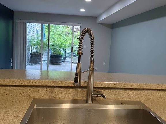 Open floor plan between Kitchen and Living room with 42in breakfast bar