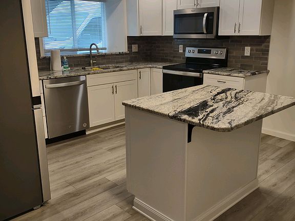 New kitchen, granite counters/island, new appliances, tile back splash