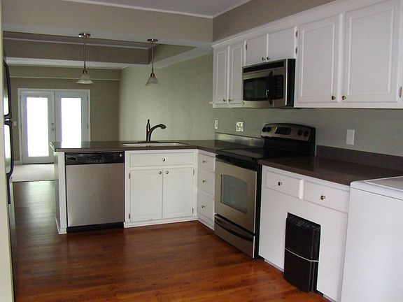 Open Kitchen with all stainless steel appliances.