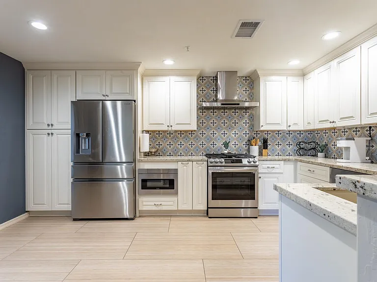 HIgh end gourmet kitchen with gas appliances, granite counters, all remodeled