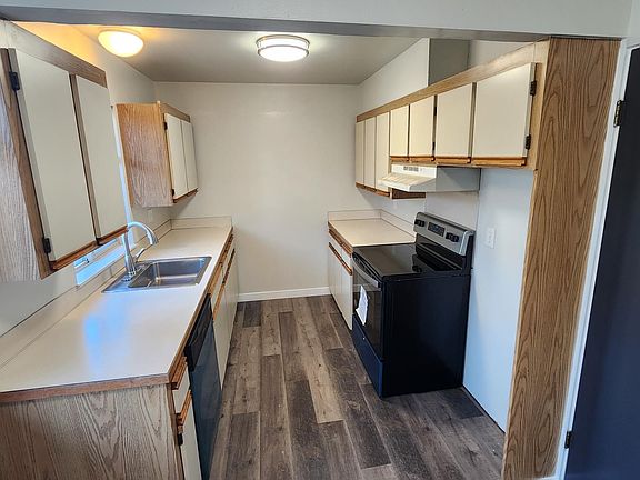 Kitchen with brand new refrigerator and new range
