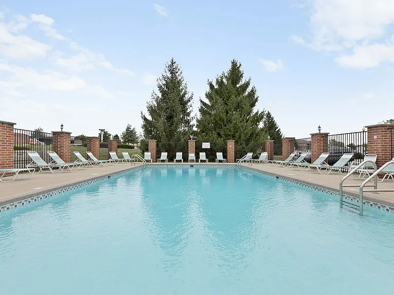 A refreshing dip, framed by greenery. The pool feels like a private escape.