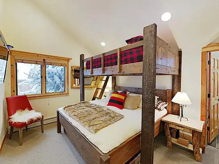 Bunk bed in second bedroom. Queen on top of king bed and one twin trundle below