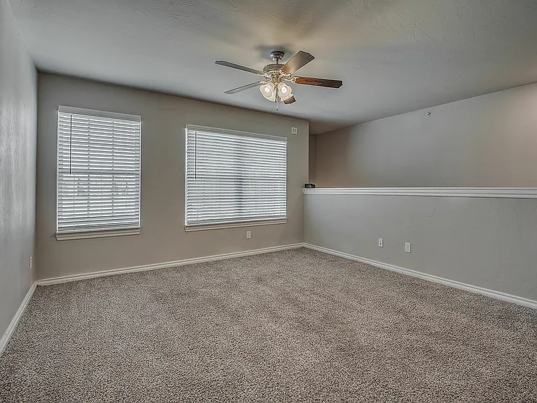 Experience this spacious living area bathed in natural light.