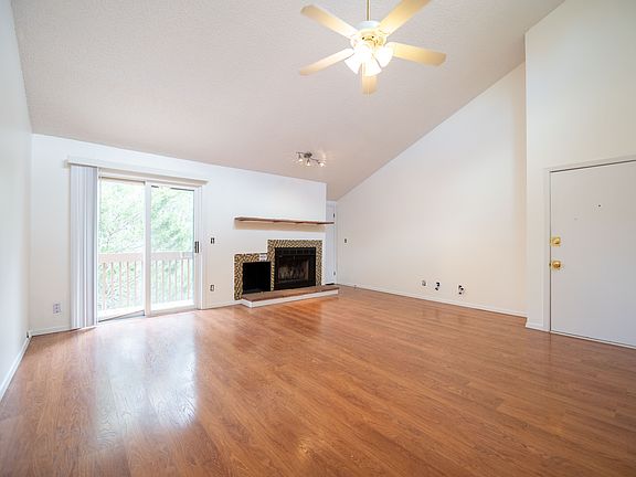 Vaulted ceiling and storage area in living room