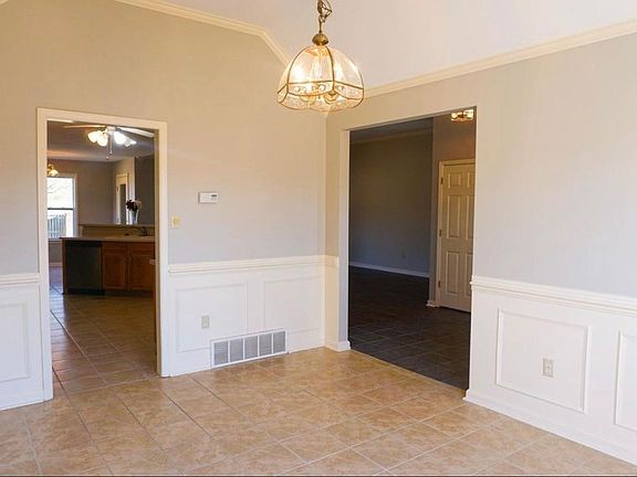 Separate dining room with tile floors.