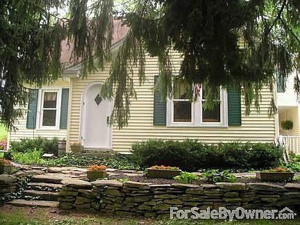 Hand laid stone wall adds tons of character and charm to this much loved home.