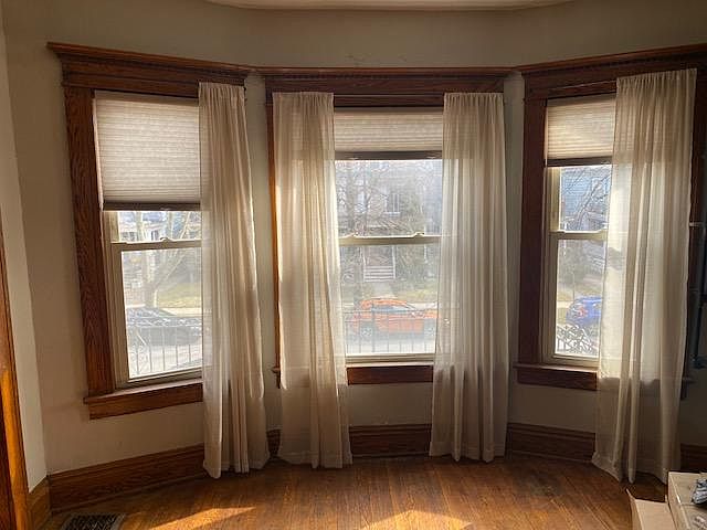 Family room with large windows overlooking 2nd floor porch, perfect for an urban gardener!